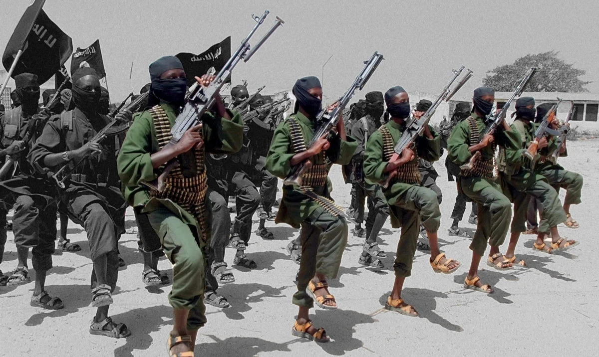 Hundreds of newly trained Al-Shabab fighters perform military exercises near Mogadishu, Somalia, on Feb. 17, 2011. (AP)