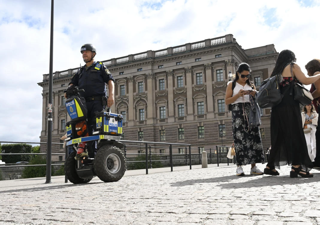 A police officer on a Segway patrols Sweden’s parliament in Stockholm, Aug. 17, 2023. (AP/File)