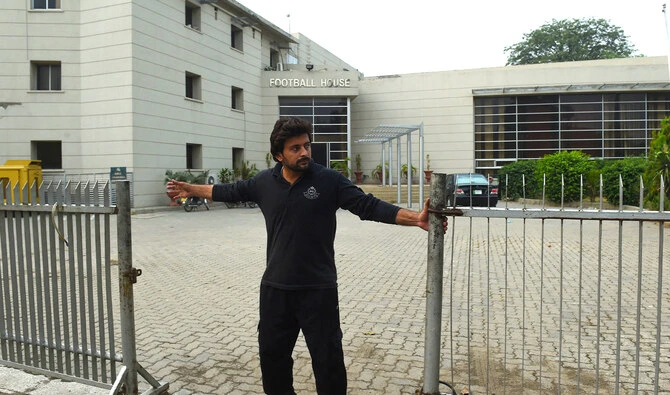A Pakistani security personnel closed the main entrance of Pakistan Football Federation (PFF) office in Lahore in October 2017. (AFP/File)