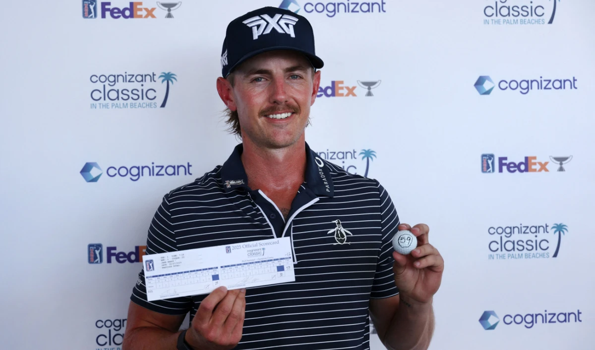 Jake Knapp of the US poses with his scorecard and his ball after shooting a 59 during the first round of the Cognizant Classic in The Palm Beaches 2025 at PGA National Resort And Spa on Thursday in Palm Beach Gardens, Florida. (AFP)