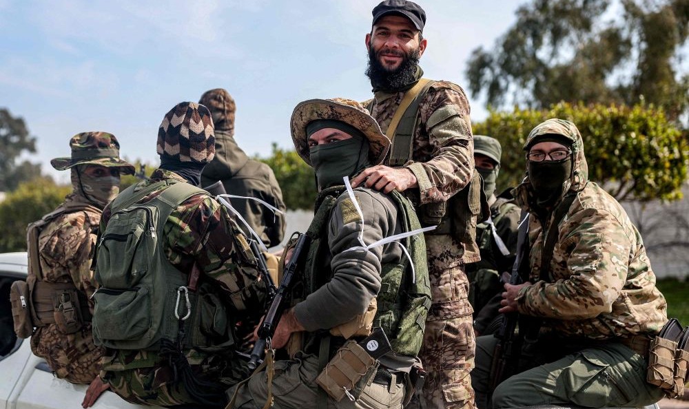 Security forces loyal to the interim Syrian government in Latakia, Mar. 9, 2025. (AFP)