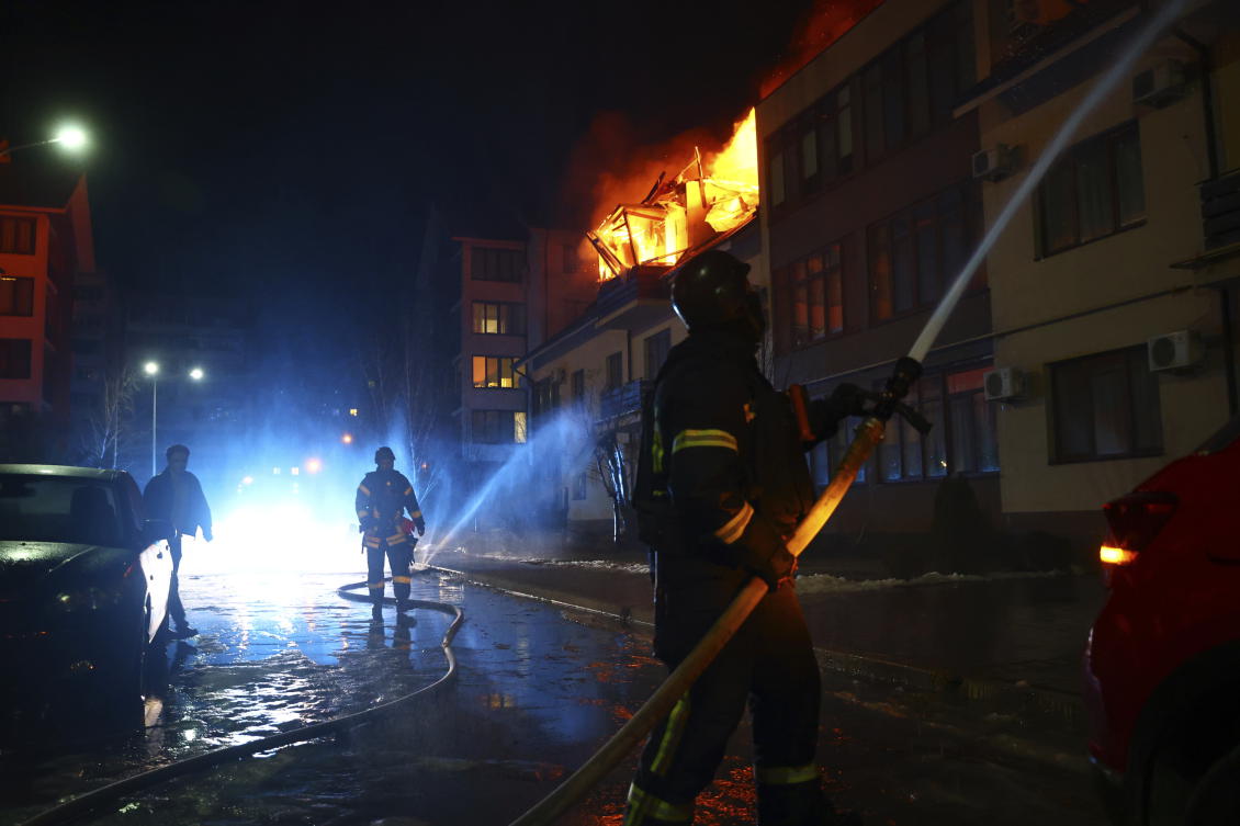Rescue workers put out a fire from a house hit by a Russian drone strike on a residential neighborhood in Zaporizhzhia, Ukraine, Saturday, March 1, 2025. (AP)