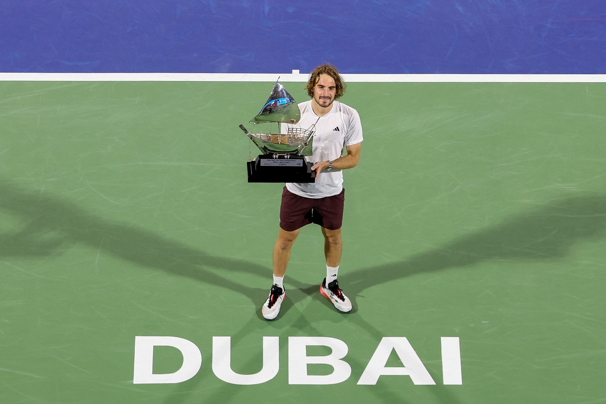Stefanos Tsitsipas of Greece with the ATP Dubai Duty Free Tennis Championship men’s trophy. (Supplied)