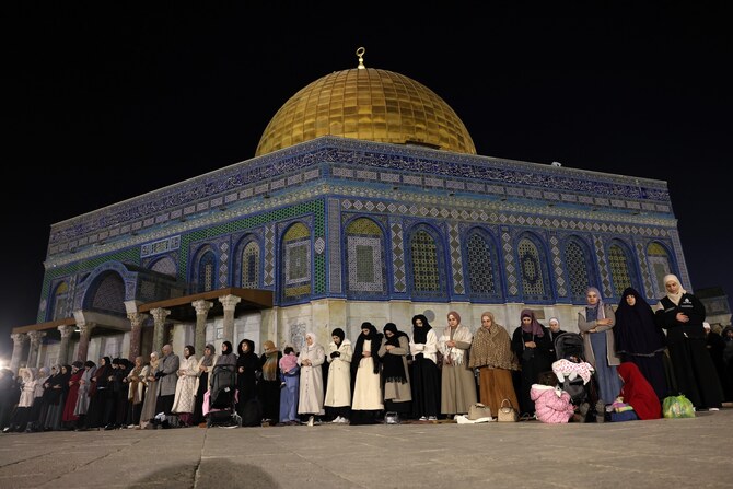 Palestinian devotees perform an evening prayer known as ‘Tarawih’ in front of the Dome of the Rock shrine at the Al-Aqsa mosque compound in Jerusalem, Feb. 28, 2025. (AFP)