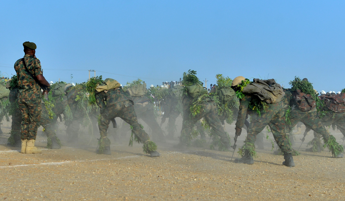 Newly graduated Sudanese army soldiers show their skills during a ceremony in Merowe in northern Sudan on February 27, 2025. Since April 2023, Sudan has been engulfed in a war between the army the paramilitary Rapid Support Forces (RSF). (AFP)