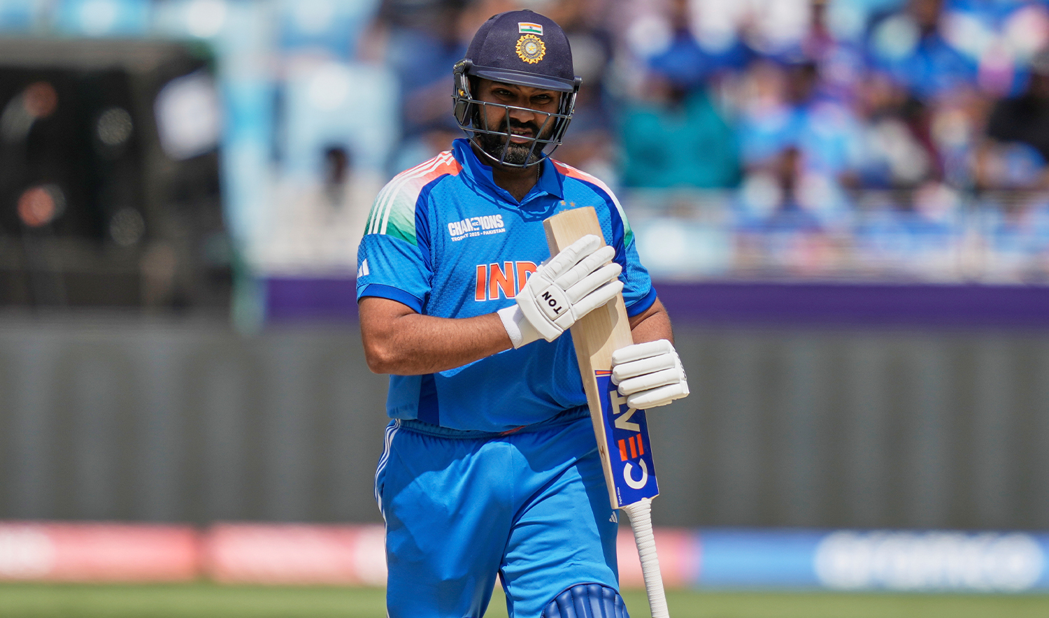 India’s captain Rohit Sharma walks off the field after losing his wicket during the ICC Champions Trophy cricket match between India and New Zealand at Dubai International Cricket Stadium in Dubai, United Arab Emirates, on March 2, 2025. (AP)