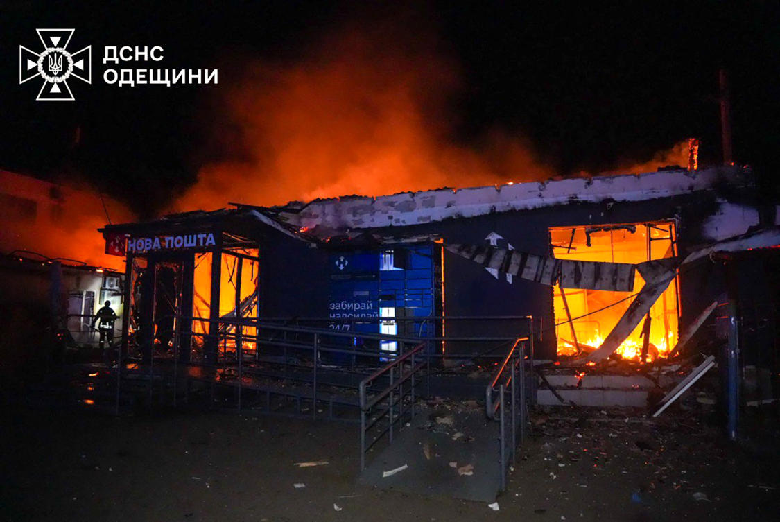 This handout photograph released by the Ukrainian Emergency Service early on March 5, 2025, shows a Ukrainian rescuer working to extinguish a fire in a building following an attack at an undisclosed location in Odesa region, amid the Russian invasion of Ukraine. (AFP)