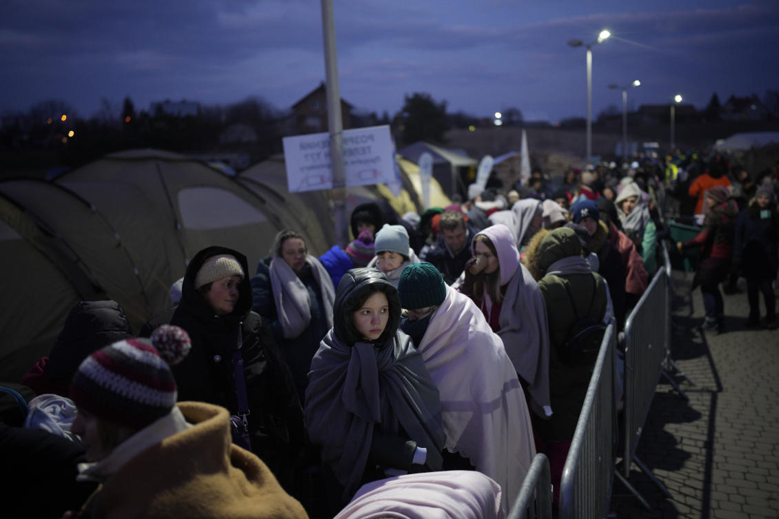 Refugees fleeing war in neighboring Ukraine queue at the Medyka border crossing, Poland, Thursday, March 10, 2022. (AP)