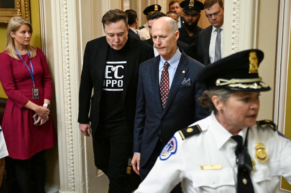 Elon Musk, accompanied by US Senator Rick Scott (R-FL), arrives for a meeting with the Senate Republican Steering Committee at the US Capitol in Washington, DC, on March 5, 2025. (AFP)