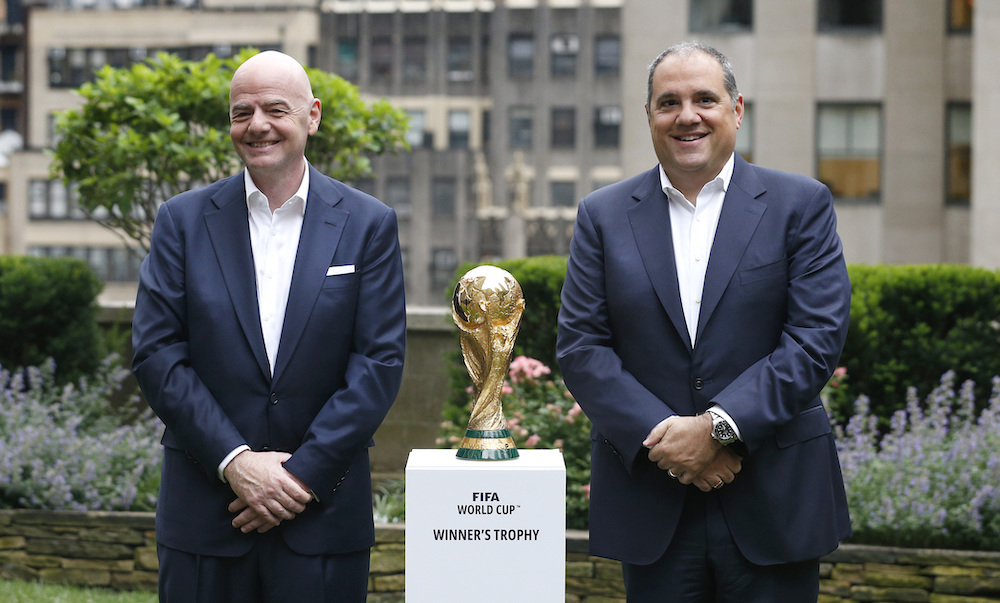 FFIFA President Gianni Infantino, left, and FIFA Vice President Vittorio Montagliani stand with the World Cup trophy on June 16, 2022 in New York. (AP file photo)