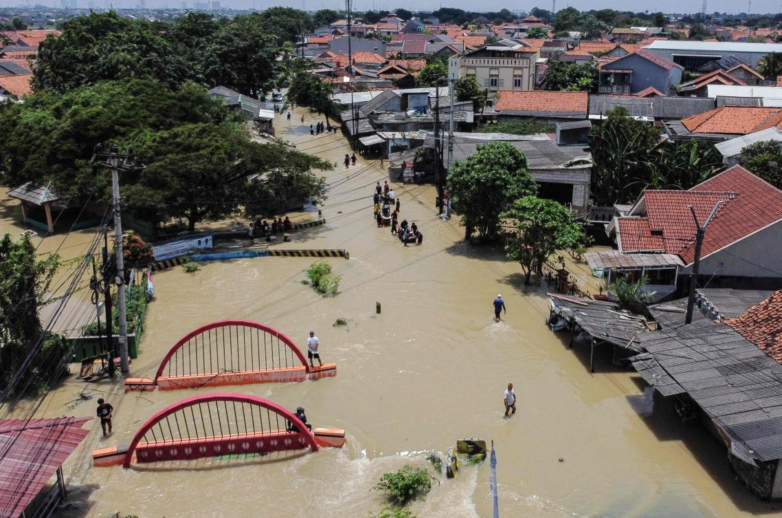 An aerial picture shows a flooded residential area after some rivers overflowed following heavy rain in Bekasi, a suburb of Jakarta, on March 5, 2025. (AFP)