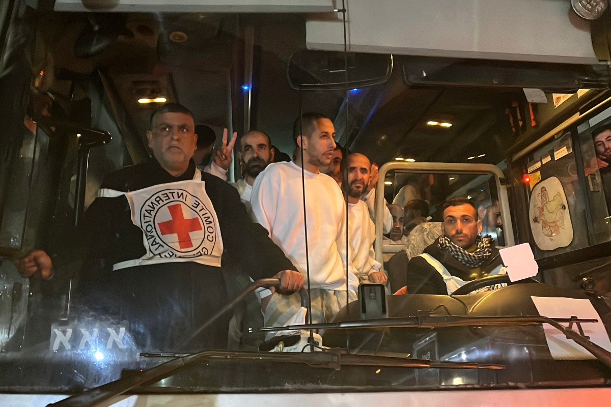 Palestinian prisoners, released by Israel, gesture as they arrive on a bus at the European Hospital in Khan Yunis in the southern Gaza Strip early on February 27, 2025 (AFP)