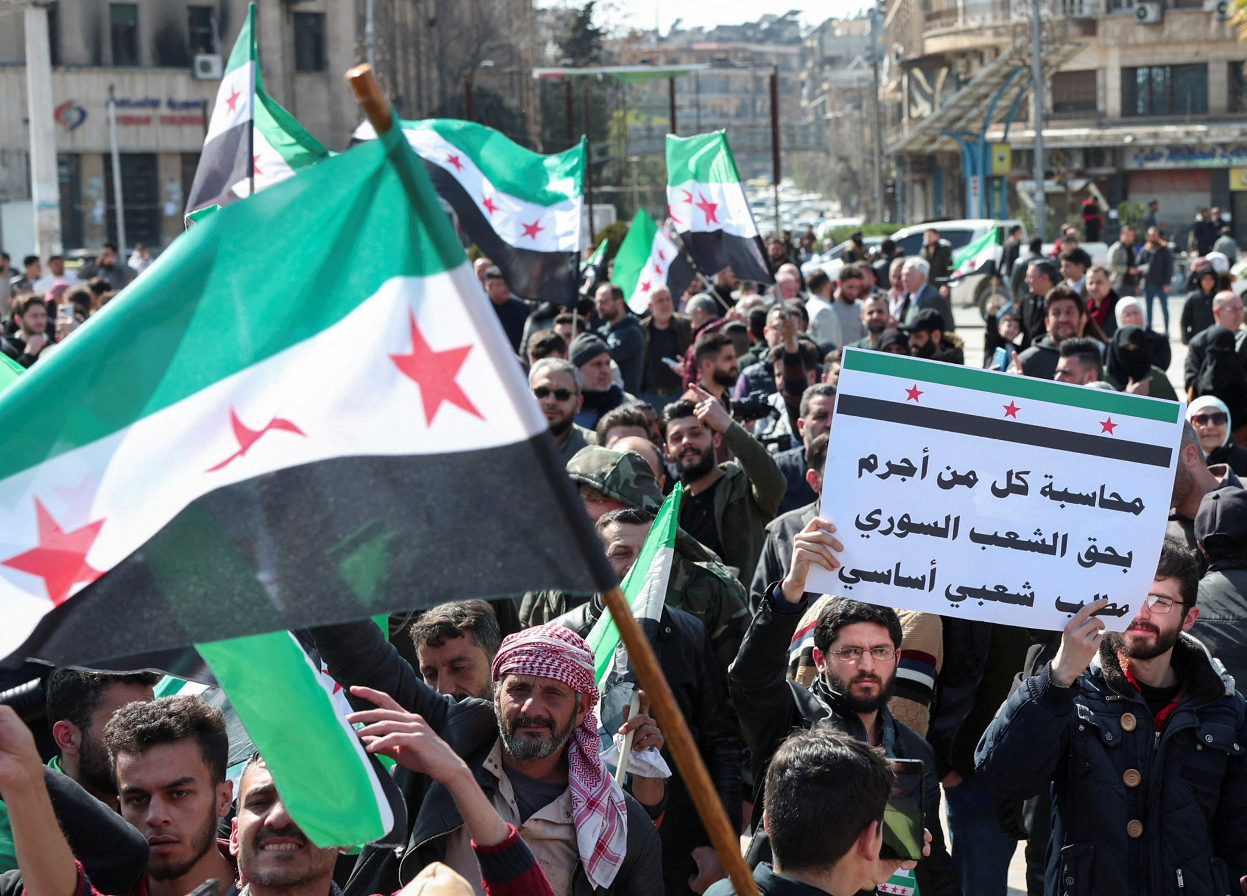 Syrians demonstrate in support of the Syrian government, after attacks carried out by groups loyal to ousted leader Bashar Assad in the Latakia region, in Aleppo, Syria, March 7, 2025. (Reuters)