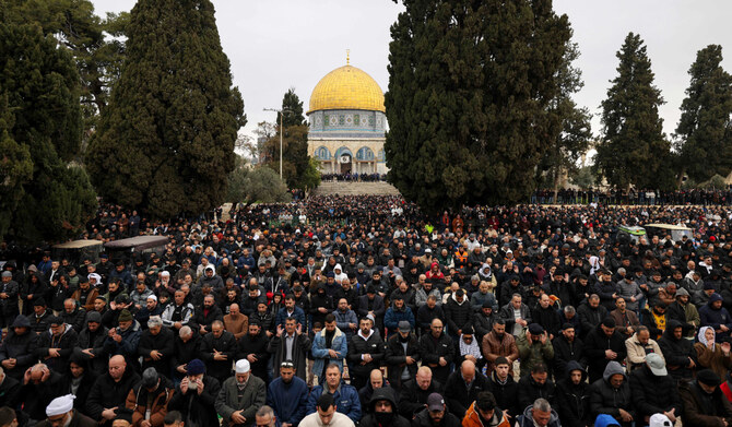 Palestinian Muslim worshippers pray outside the Dome of the Rock mosque at the Al-Aqsa mosque compound in Jerusalem's Old City during the first Ramadan Friday noon prayer, on March 7, 2025, during Islam's fasting holy month. (AFP)