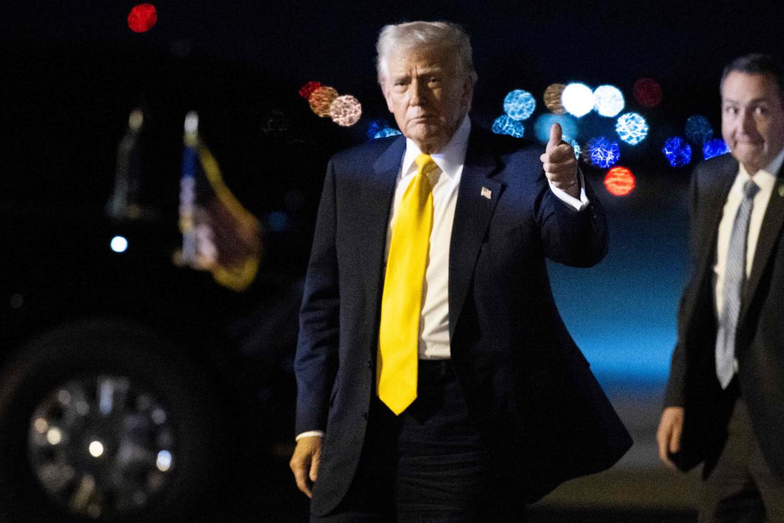 US President Donald Trump gives a thumb's up after stepping off Air Force One at Palm Beach International Airport in West Palm Beach, Florida, on March 7, 2025. Trump is spending the weekend at his Mar-a-Lago resort. (AFP)