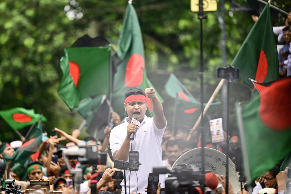 A student shouts slogans as demonstrators join the Martyr March, a rally organized by Students Against Discrimination to mark one month to the ousting of the country’s former Prime Minister Sheikh Hasina in Dhaka on Sept. 5, 2024. (AFP)