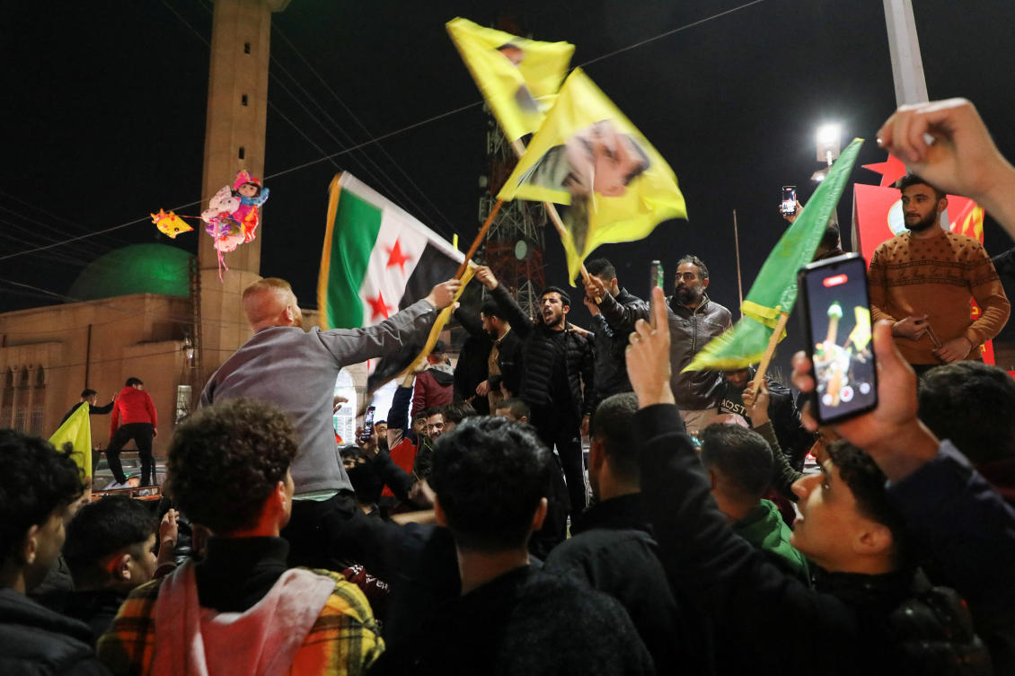 People celebrate, after the Kurdish-led and US-backed Syrian Democratic Forces (SDF), which controls much of Syria’s oil-rich northeast, signed a deal agreeing to integrate into Syria’s new state institutions, the Syrian presidency said on Monday, in Qamishli, Syria, March 10, 2025. (Reuters)