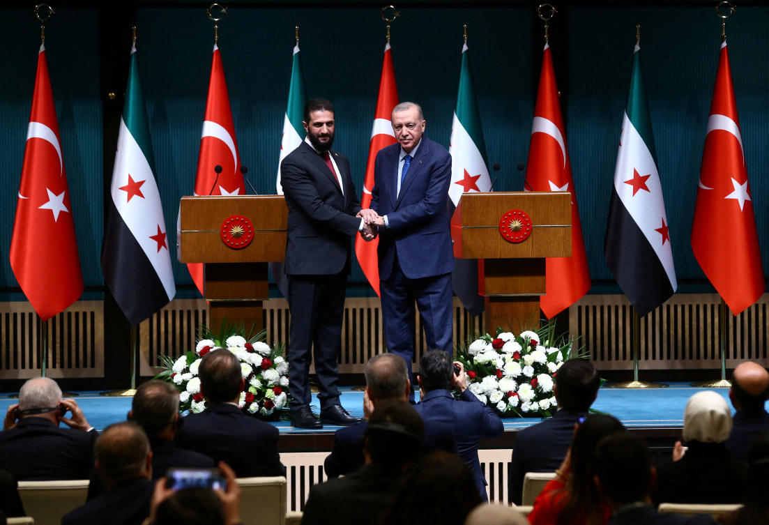 Syria’s newly appointed president for a transitional phase Ahmed Al-Sharaa and Turkiye’s President Tayyip Erdogan shake hands at the Presidential Palace in Ankara, Turkiye, Feb. 4, 2025. (Reuters)
