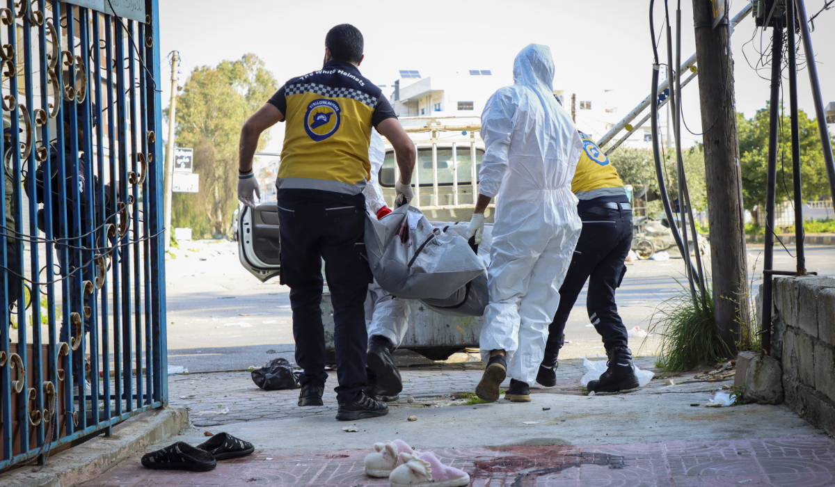 In this photo provided by the Syrian Civil Defense White Helmets, members of the Syrian White Helmets collect the bodies of people found dead following a recent wave of violence between Syrian security forces and gunmen loyal to former President Bashar Assad, as well as subsequent sectarian attacks, in the coastal city of Baniyas, Syria, Sunday, March 9, 2025. (AP)
