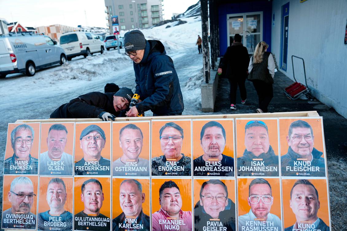 Election posters for Greenland's nationalist Naleraq party are being set up in Nuuk, Greenland, on March 11, 2025.. The first votes are cast for the parliamentary election to the Inatsisartut in Godthaabshallen in Nuuk, Greenland, on Tuesday, March 11, 2025. (AFP)