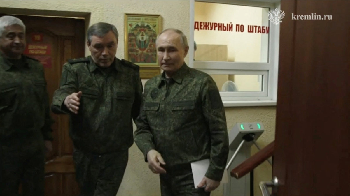 Russian President Vladimir Putin walks next to Chief of the General Staff of Russian Armed Forces Valery Gerasimov as he visits the army command center in the Kursk region, Russia, on March 12, 2025. (Kremlin.ru/Handout via REUTERS)