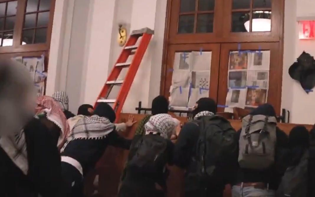 Screengrab taken from a video showing pro-Palestinian protesters inside Columbia University which says its judicial board had issued sanctions against dozens of students who occupied Hamilton Hall. (X/@LishiBaker)