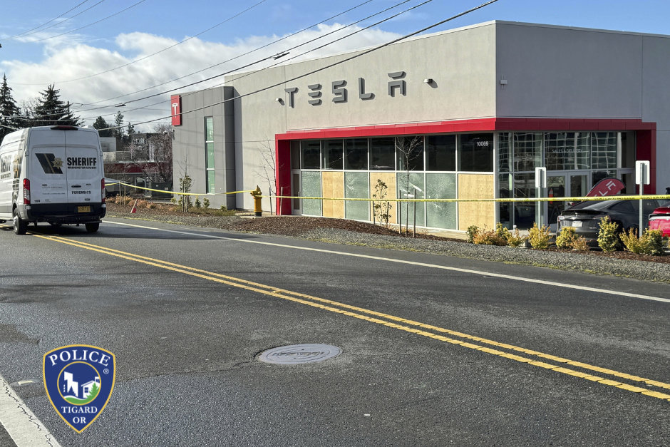 This photo provided by Tigard Police Department shows the boarded-up windows of a Tesla Dealership in Tigard, Oregon on March 13, 2025, after gunshots were fired for the second time in one week. (Tigard Police Department via AP)
