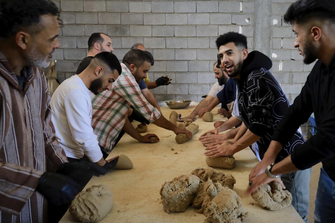 Volunteers prepare Bazin, traditional Libyan dough bread made of barley or whole wheat flour and often served with stew in Tajoura, east of Libya’s capital Tripoli, Mar. 11, 2025, during Ramadan. (AP)