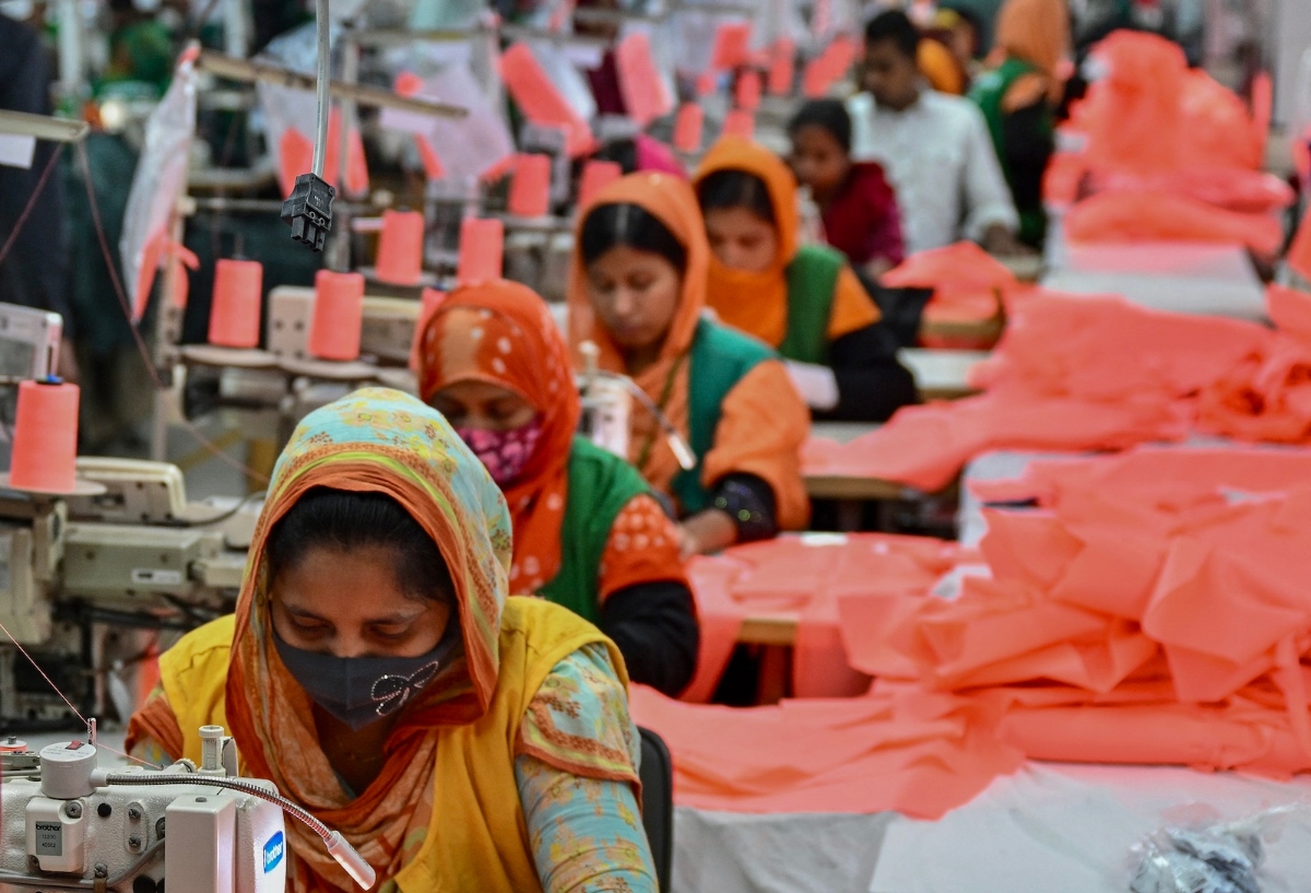 This photograph taken on Dec. 29, 2024, shows garment workers sewing clothes at a textile factory in Dhamrai, a sub-district in Dhaka. (AFP)