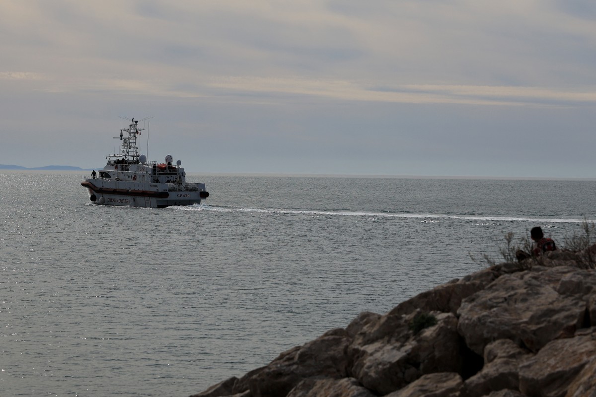 An Italian coastguard ship leaves leaves the Shengjin Port in Albania (AFP)
