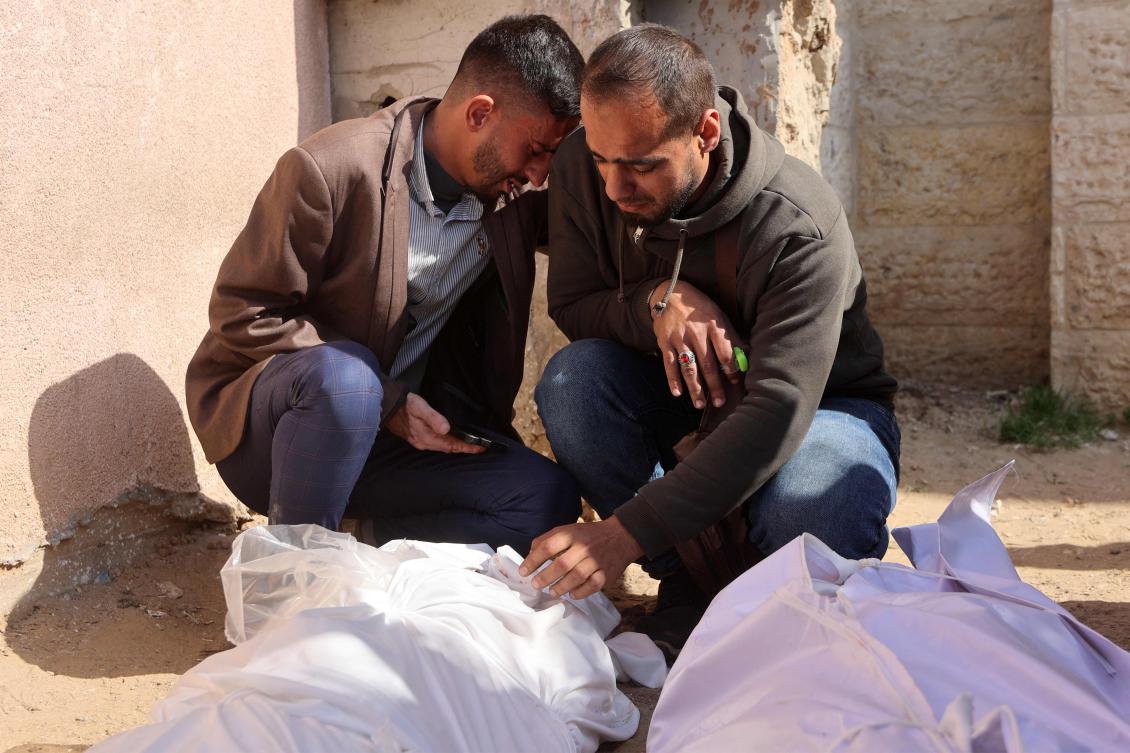 Mourners gather by the shrouded bodies of victims killed by Israeli bombardment in Beit Lahia in the northern Gaza Strip, outside the Indonesian hospital in Beit Lahia on March 15, 2025. (AFP)