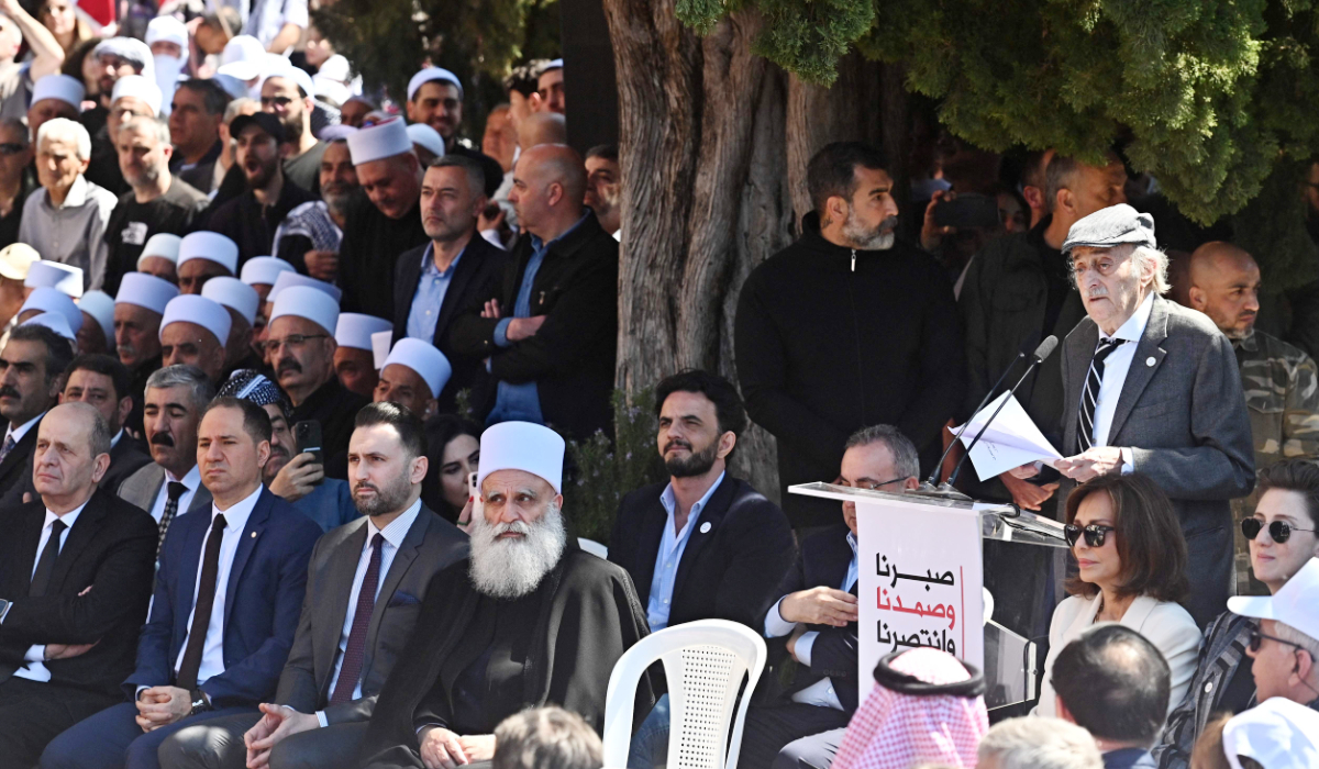 Walid Jumblatt (R), the former leader of Lebanon's Progressive Socialist Party (PSP), delivers a speech during a ceremony marking the 48th anniversary of his father Kamal Jumblatt's assassination, at the El-Moukhtara palace in Lebanon's Shouf mountains on March 16, 2025, in (2ndR) and Lebanese Phalangist party chief Sami Gemayel (2nd L). (AFP)