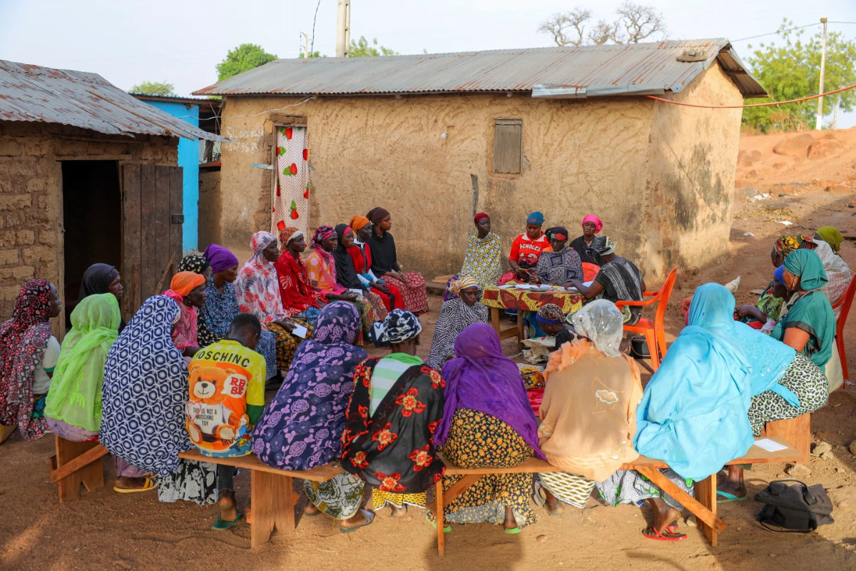 Members of a micro-credit cooperative meet in a compound at Kimbirila-Nord, the last village to the Mali border in Ivory Coast, Feb. 22, 2025. (AP Photo/Misper Apawu)e