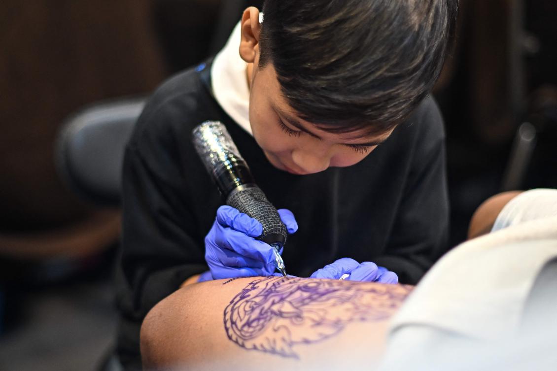 Nine-year-old Thai tattooist makes his mark