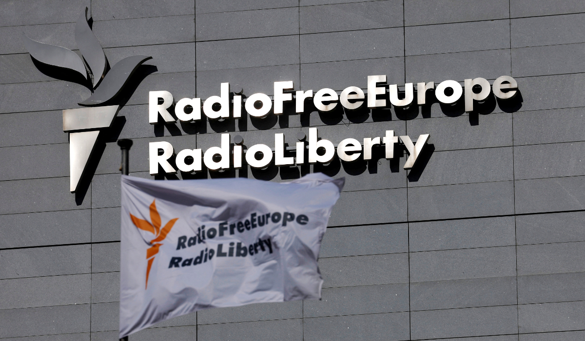 A flag and a sign of Radio Free Europe/Radio Liberty are shown at its headquarters in Prague, Czech Republic, March 17, 2025. (REUTERS)