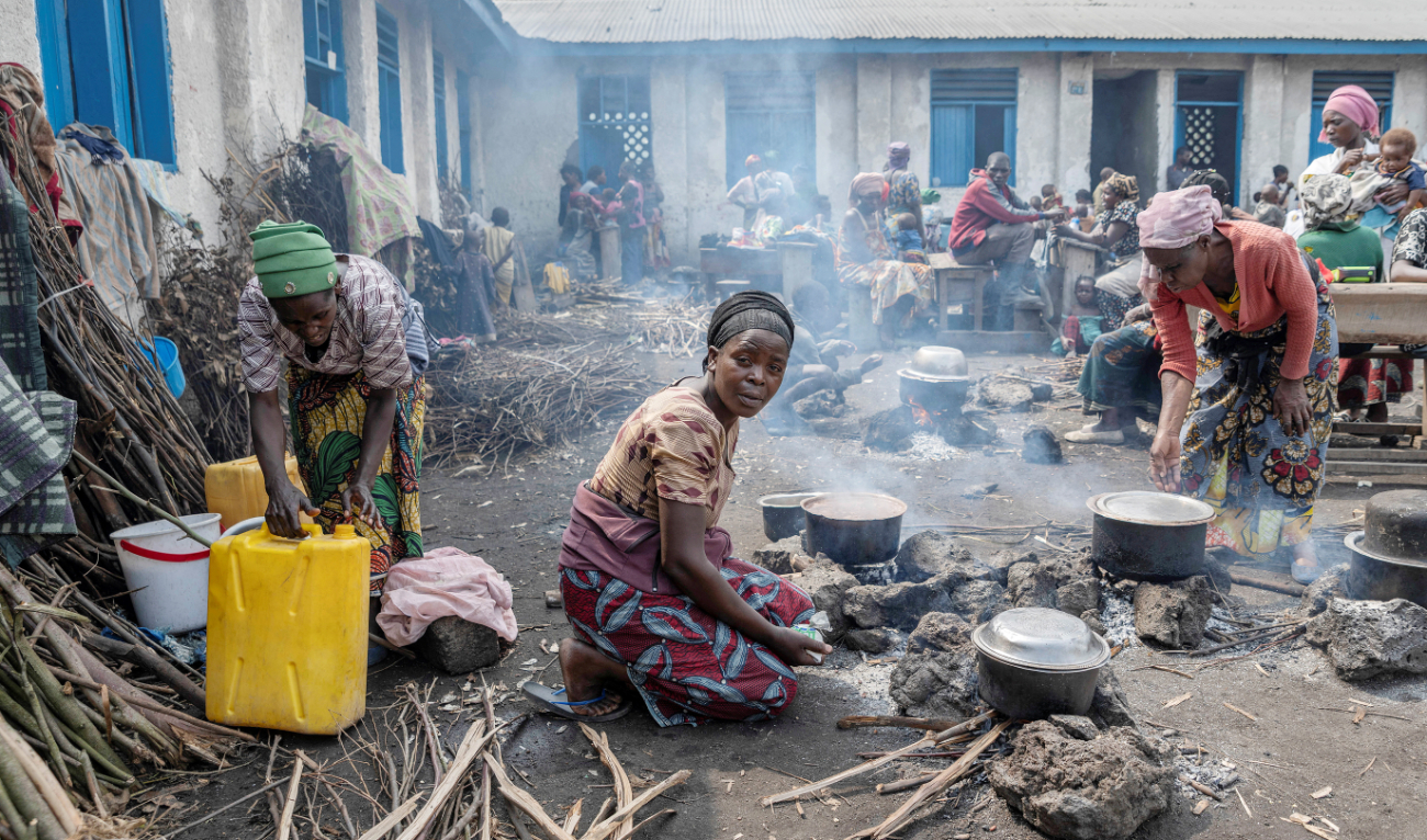 Internally displaced families prepare in a schoolyard in eastern Democratic Republic of Congo. (File/Reuters)