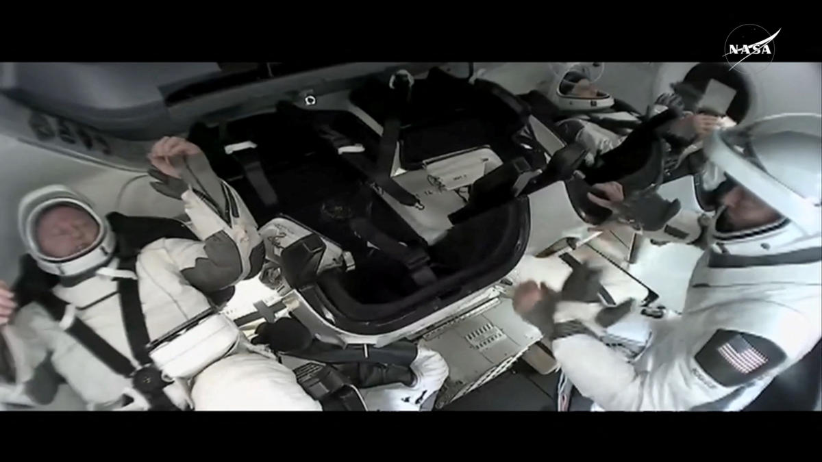 NASA Butch Wilmore and Suni Williams sit inside a SpaceX Crew Dragon capsule before closing the hatch in preparation for undocking from the ISS to begin their return to Earth March 17, 2025 in this still image taken from video. (NASA via Reuters)