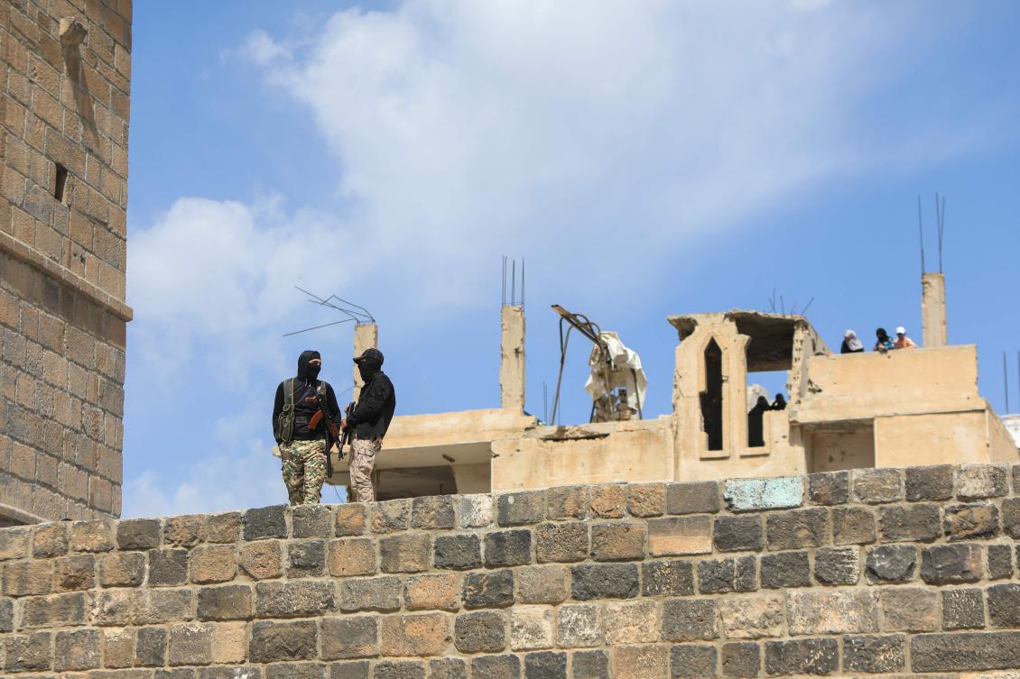 Members of Syria’s security forces stand guard during the funeral of three people killed in Israeli strikes a day earlier, in the southern town of Daraa on Mar. 18, 2025. (AFP)