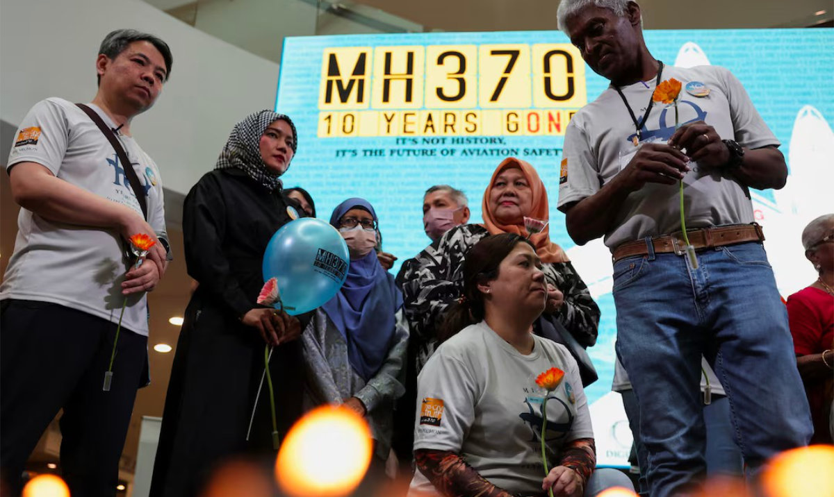 Families of passengers from both China and Malaysia at an event commemorating the 10th anniversary of its disappearance. (Reuters)