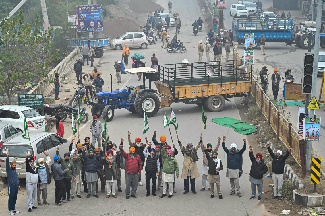 Farmers shout slogans as they block a road during the ‘Punjab Bandh’, a statewide strike against the central government demanding minimum support price on the outskirts of Amritsar on Dec. 30, 2024. (AFP)