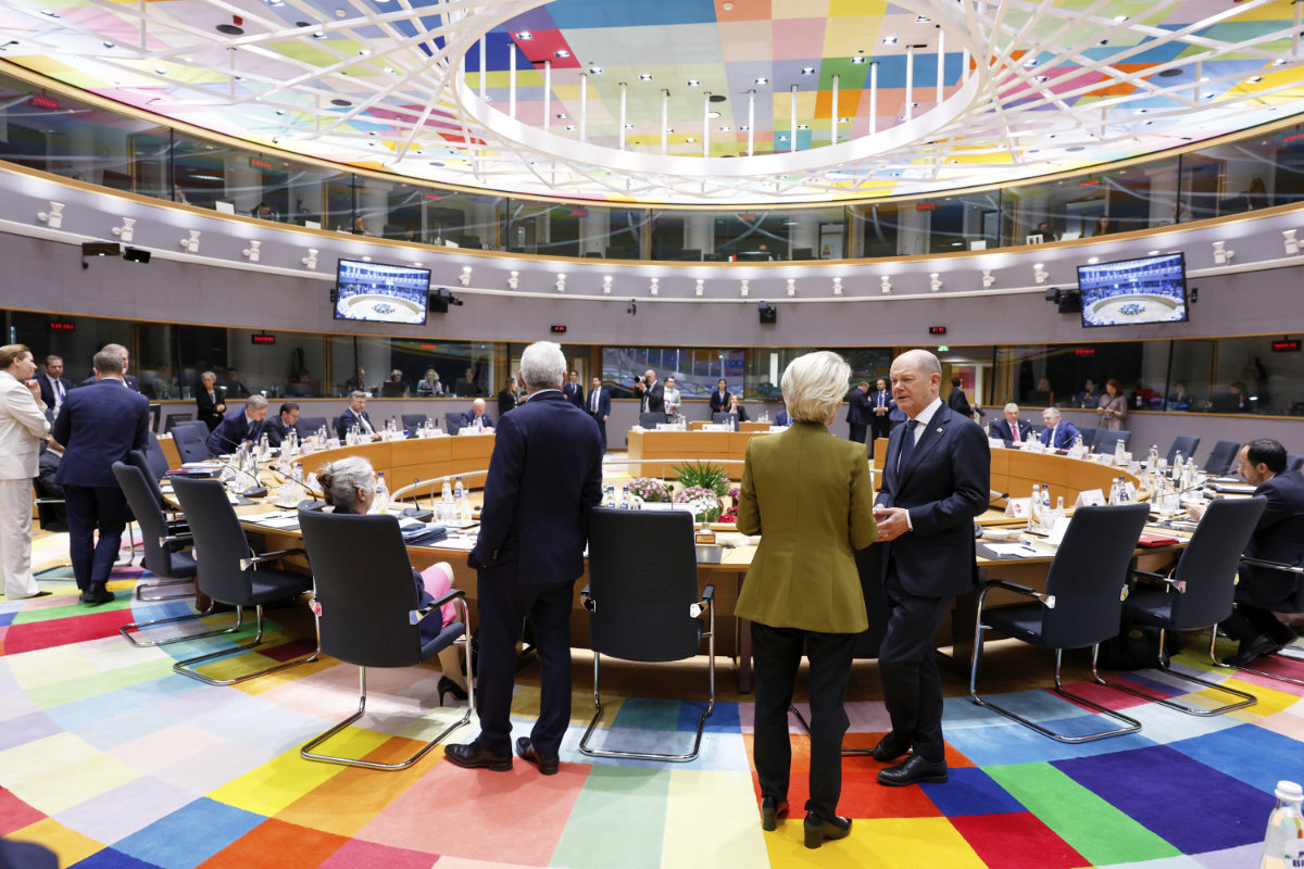 European Commission President Ursula von der Leyen, center, speaks with Germany's Chancellor Olaf Scholz during a round table meeting at an EU summit in Brussels on March 20, 2025. (AP Photo)