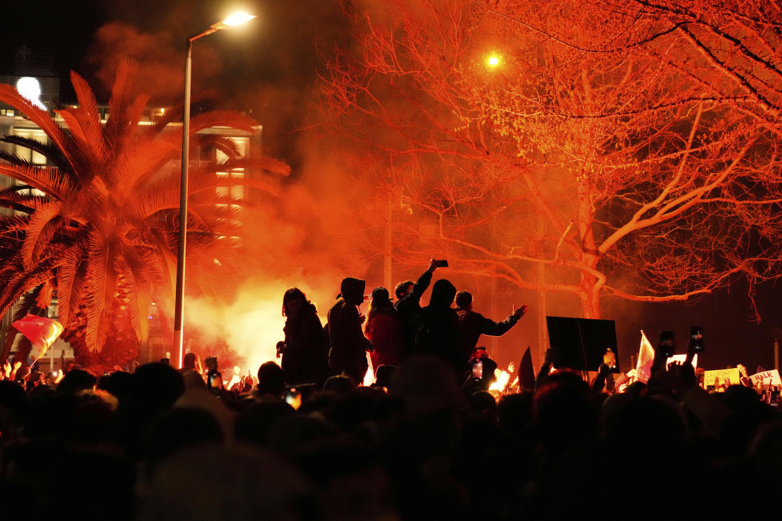People light flares in Istanbul, Turkiye, Thursday, March 20, 2025, as they protest against the arrest of Istanbul’s Mayor Ekrem Imamoglu. (AP)
