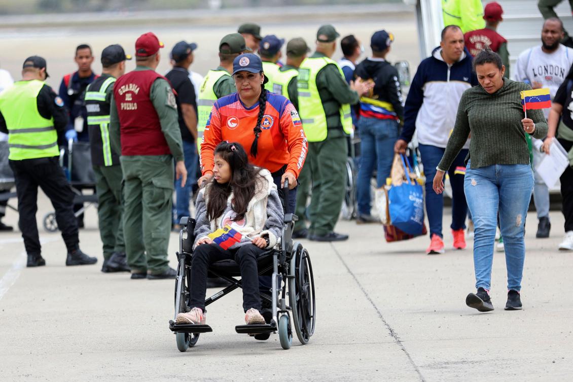 A Venezuelan migrant is wheeled on a wheelchair upon arrival at Simon Bolivar International Airport in Maiquetia, Venezuela on March 20, 2025. (AFP)