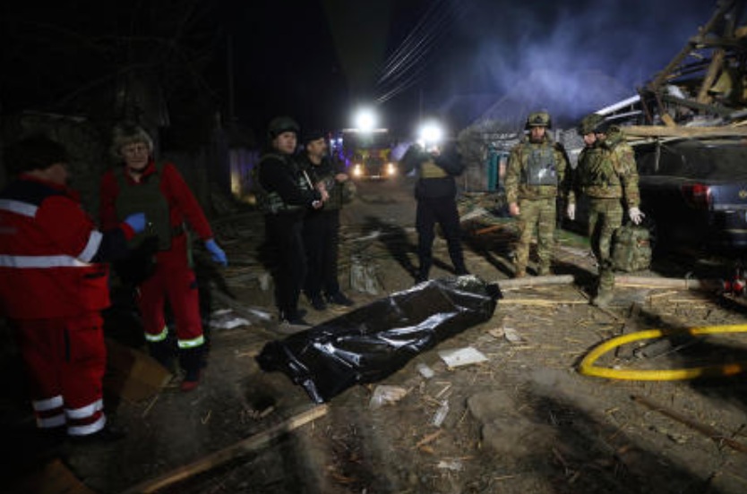 A body of a person lies on a street after a Russian drone strike on residential neighborhood on Zaporizhzhia, Ukraine, Mar 21, 2025. (AP)