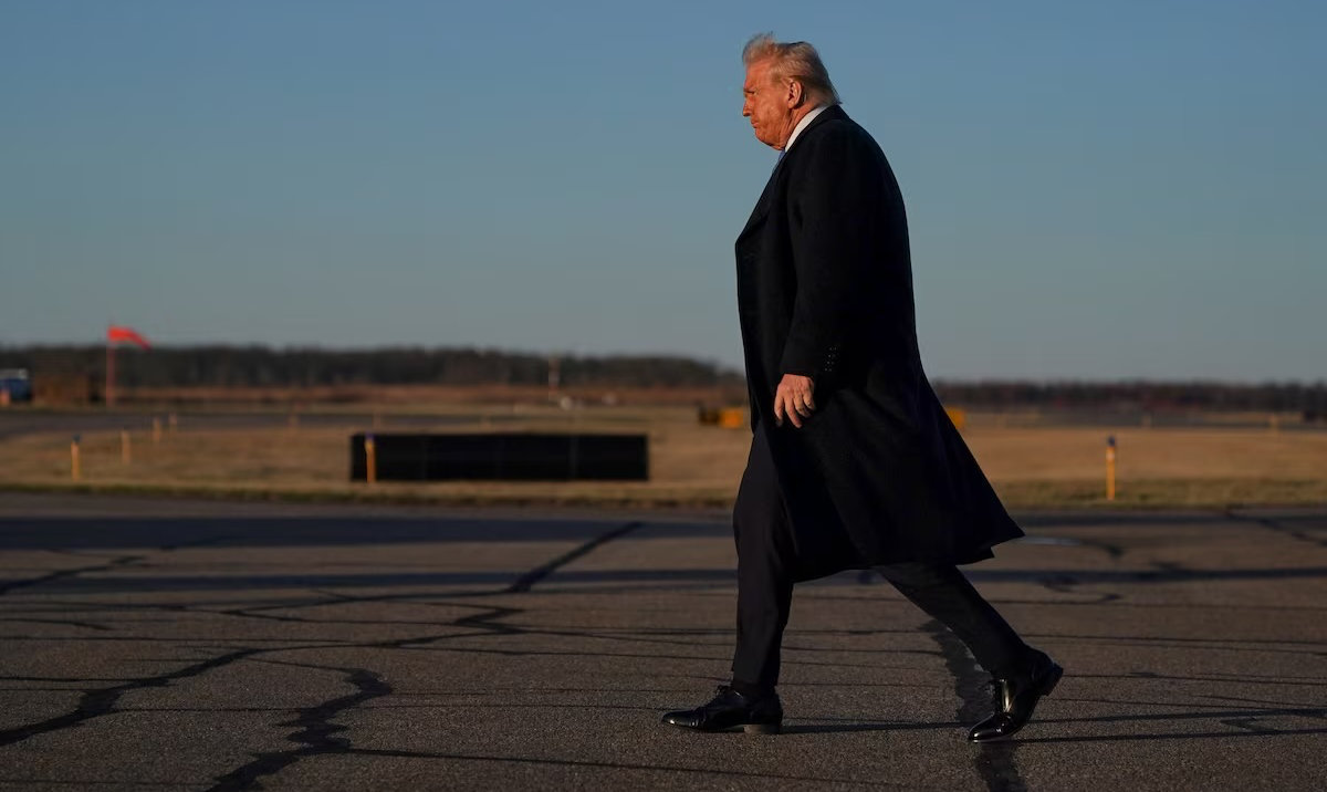 US President Donald Trump walks at Morristown Municipal Airport in Morristown, New Jersey, US, March 21, 2025. (Reuters)
