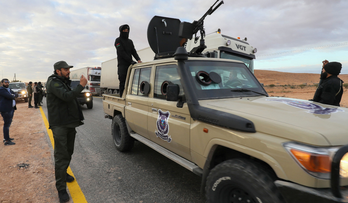 Libyan special forces in charge of illegal migration assemble in the southern region of Bani Walid, on January 14, 2023, ahead of their mission as part of a security plan to enforce inspections at points of entry through the desert borders. (AFP)