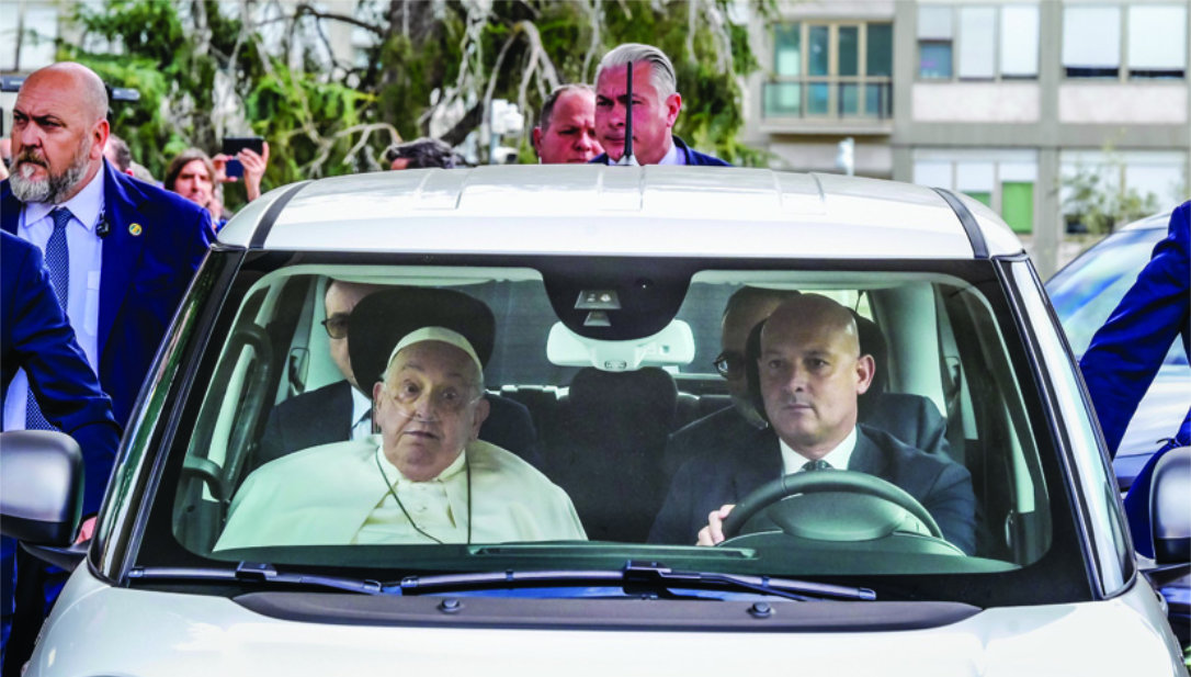 Pope Francis leaves in a car the Agostino Gemelli Polyclinic in Rome. (AP)