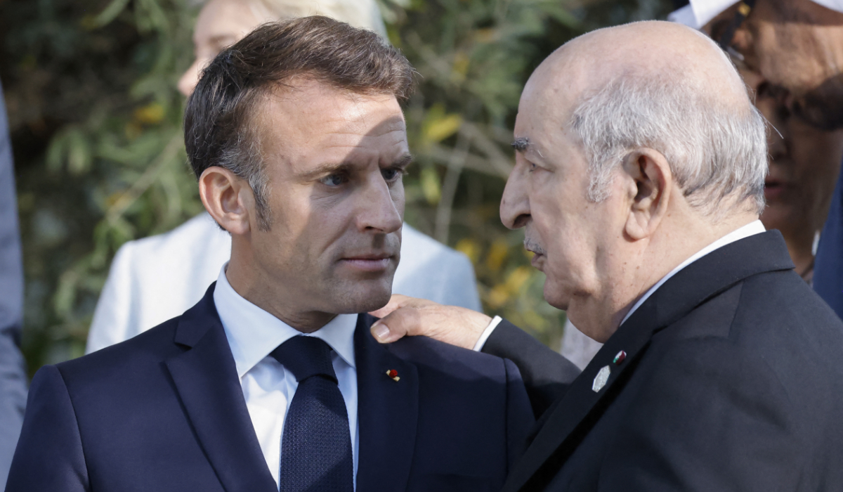 France's President Emmanuel Macron (L) talks with Algeria's President Abdelmadjid Tebboune during the G7 Summit hosted by Italy, in Savelletri, on June 14, 2024. (AFP)