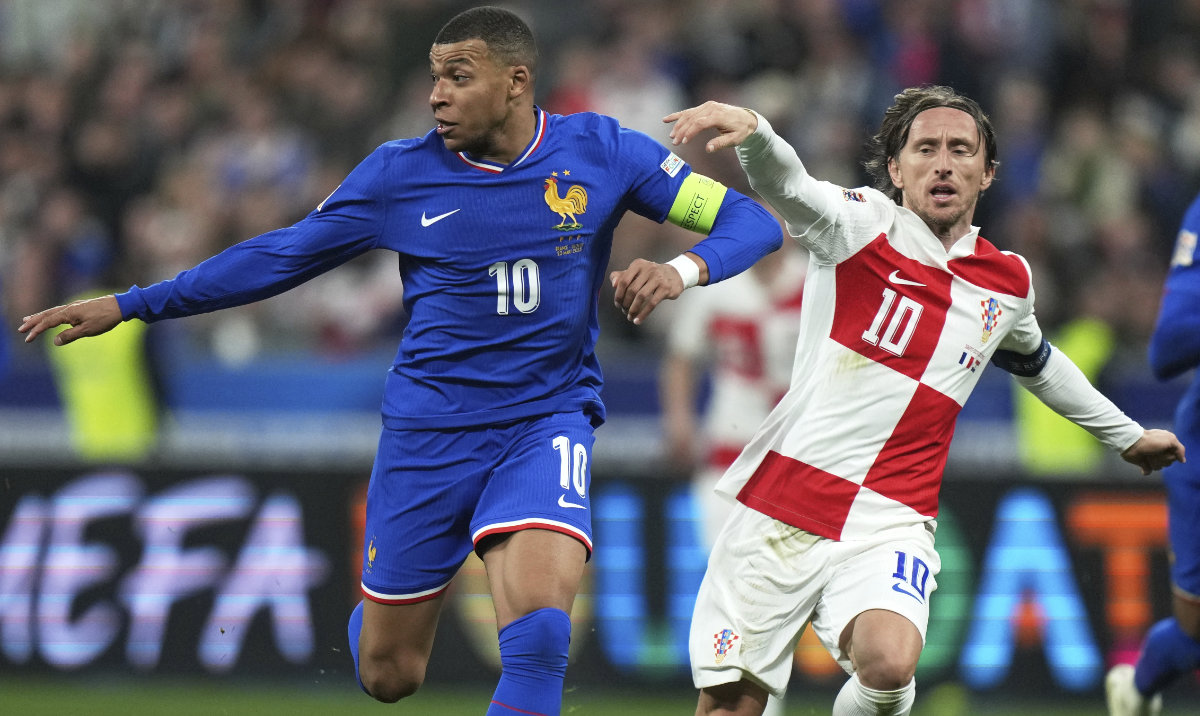 Croatia's Luka Modric, right, and France's Kylian Mbappe compete for the ball during the UEFA Nations League quarterfinal second leg soccer match between France and Croatia, at the Stade de France in Saint-Denis, outside Paris, Sunday, March 23, 2025. (AP)