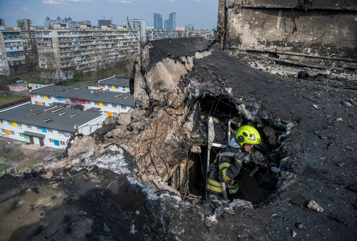 A firefighter works at a site an apartment building hit by a Russian drone strike in Kyiv, Ukraine, on March 23, 2025. (REUTERS)